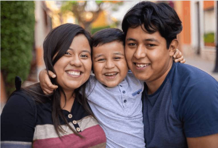 Smiling family protected by Medicare Set-Aside services